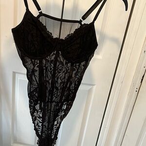 Black Lace Bodysuit with Deep V-neckline and Sheer Floral Pattern